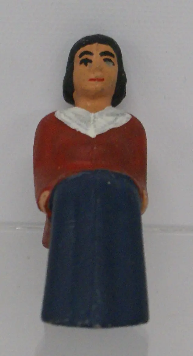 Cast Iron Seated Figure. Woman 2-3/4" X 3/4" Wide. 1
