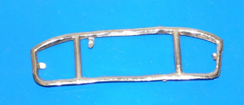 Japanese Toy Sedan Rear Windshield.  Length 3" X 3/4" 1