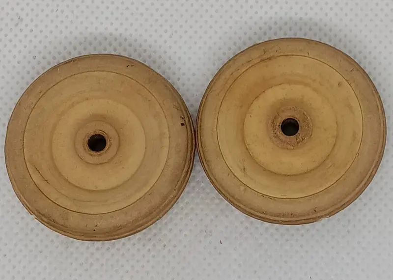 Two Original 1-1/2" Cream Wheels. Hard Rubber. 1
